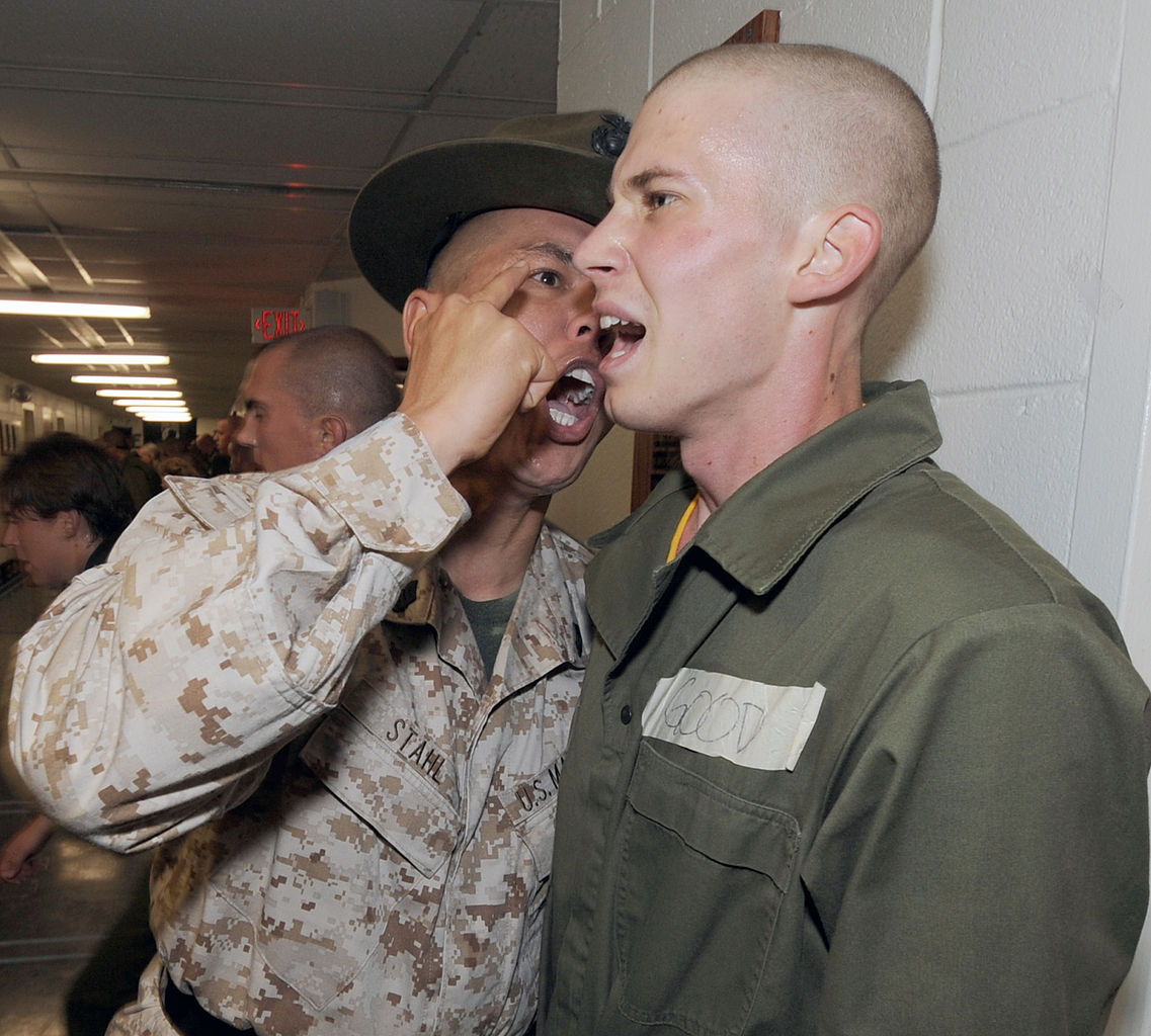 1137px-US_Navy_101029-N-8848T-409_Gunnery_Sgt._Robert_Stahl_encourages_officer_candidate_Jared_Good,_from_Towanda,_Pa.,_during_the_first_week_of_the_12-we